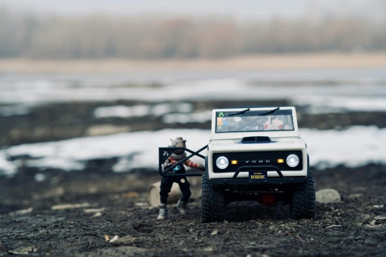 a toy truck sitting on top of a dirt field, by Sven Erixson, unsplash, fishing, as action figures, white, off - road