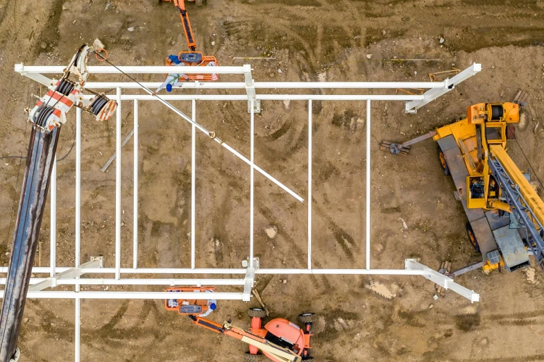 a group of construction equipment sitting on top of a dirt field, by Matthias Stom, unsplash, renaissance, 2 d overhead view, scaffolding, square lines, white limbo