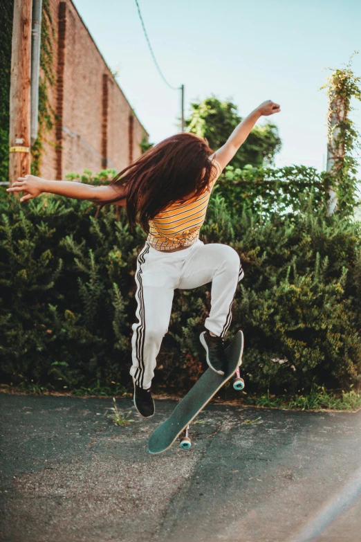 a woman flying through the air while riding a skateboard, pexels contest winner, renaissance, pants, nature outside, profile image, coloured photo