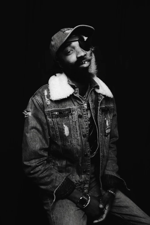 a black and white photo of a man with a beard, an album cover, by Charles Martin, unsplash, teddy fresh, he is wearing a hat, red beard, lil uzi vert