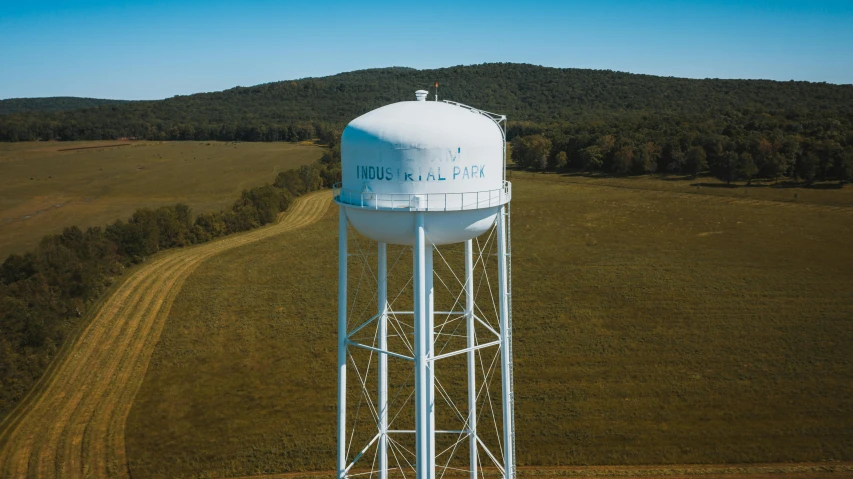 a large white water tower sitting in the middle of a field, lunapunk, listing image, iu, instagram post 4k