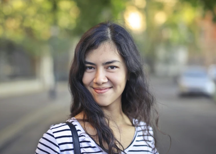 a woman standing in the middle of a street, a picture, headshot profile picture, kuntilanak, smiling young woman, avatar image