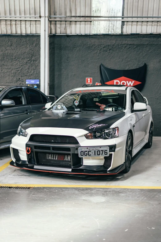 two cars parked next to each other in a garage, by An Gyeon, unsplash, low quality photo, japanese drift car, large red eyes!!!, in chippendale sydney