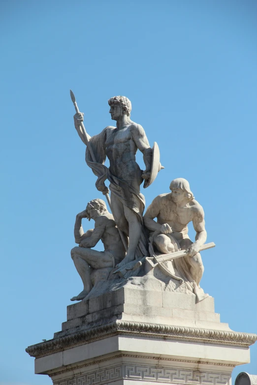 a statue that is on top of a building, buenos aires, on a pedestal