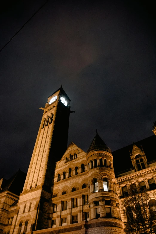 a large building with a clock tower in front of it, by Brian Thomas, dark photo, sza, marketsquare, towers