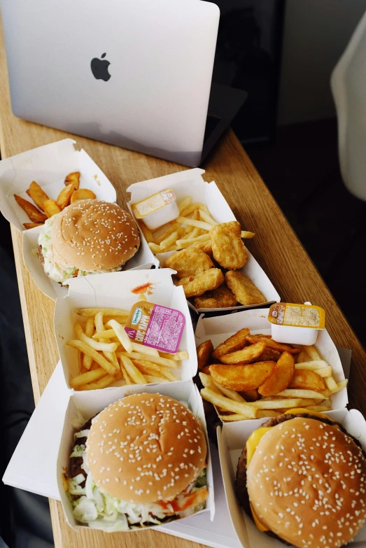 a table topped with boxes of food next to a laptop, inspired by Pia Fries, unsplash, hyperrealism, hamburgers, “diamonds, !!!! very coherent!!!!, square