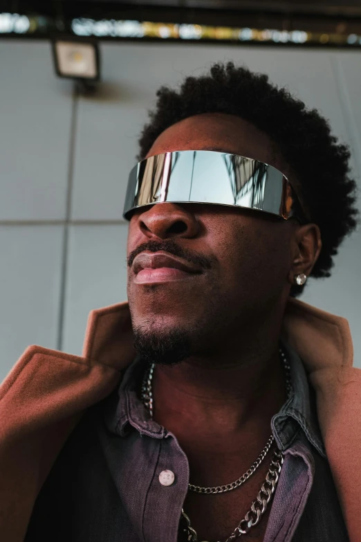 a close up of a person wearing sunglasses, inspired by Michael Ray Charles, afrofuturism, mkbhd as iron man, iridescent visor, attractive man, 2019 trending photo