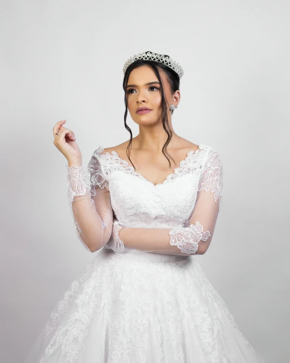 a woman in a wedding dress posing for a picture, silver prince crown, full product shot, arms to side, isabella