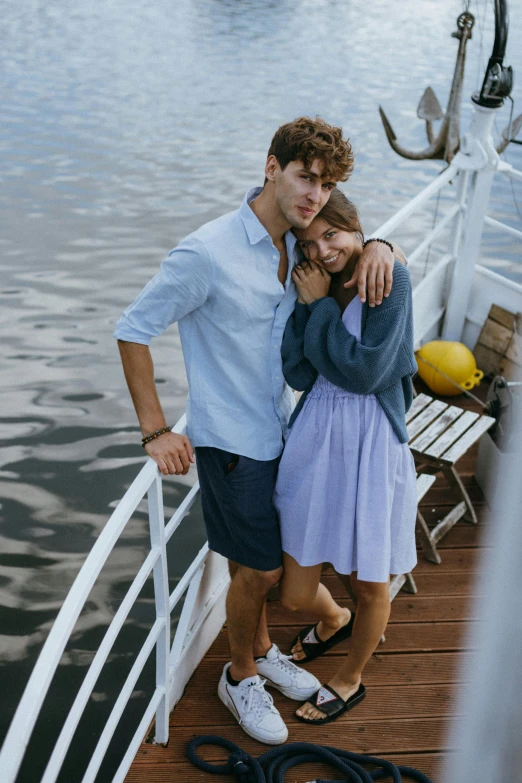 a man and woman standing next to each other on a boat, pexels contest winner, wearing a linen shirt, wears shorts, lookbook, blue