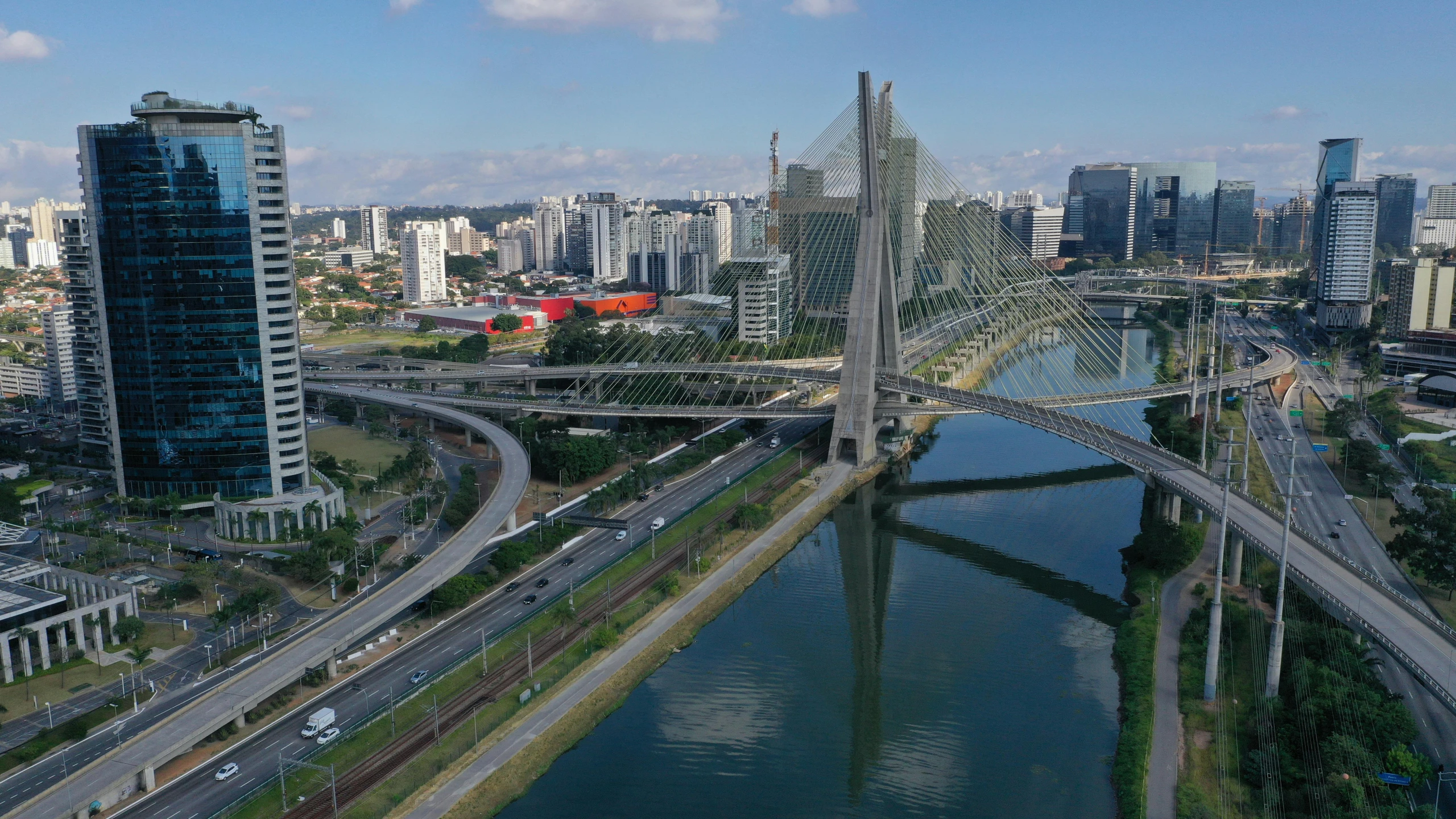 a large bridge over a river surrounded by tall buildings, by Joze Ciuha, pexels contest winner, hurufiyya, oscar niemeyer, jair bolsonaro, isometric view, zoomed out to show entire image