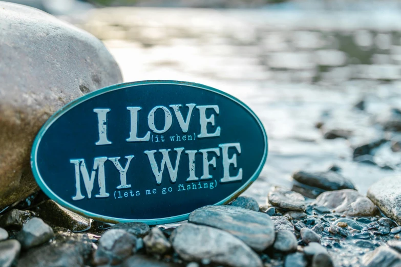 a sticker that says, i love my wife, a picture, unsplash, folk art, fishing, slate, blue, display”