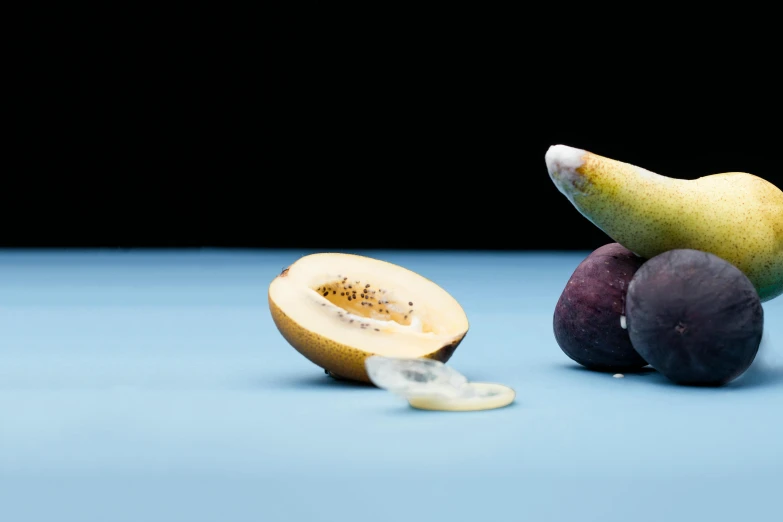 a bunch of fruit sitting on top of a table, a still life, by Jay Hambidge, unsplash, figuration libre, with a blue background, kiwi, golden ration composition, background image