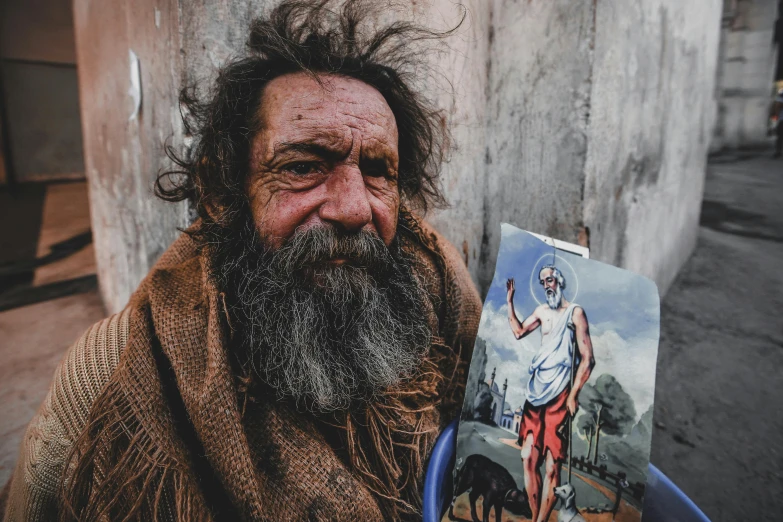 a man with a long beard holding a painting, a portrait, pexels contest winner, street art, two aboriginal elders, 🤠 using a 🖥, a photo of a disheveled man, gypsy