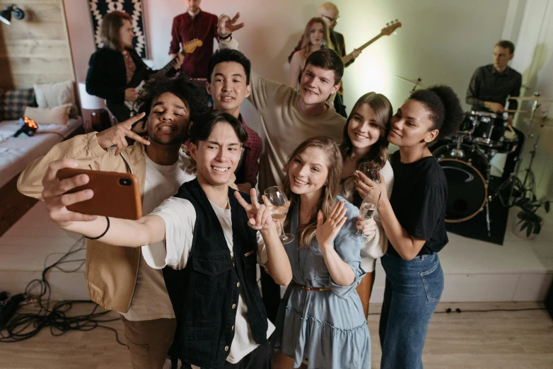 a group of people posing for a picture, an album cover, trending on pexels, happening, college party, avatar image, performing a music video, background image