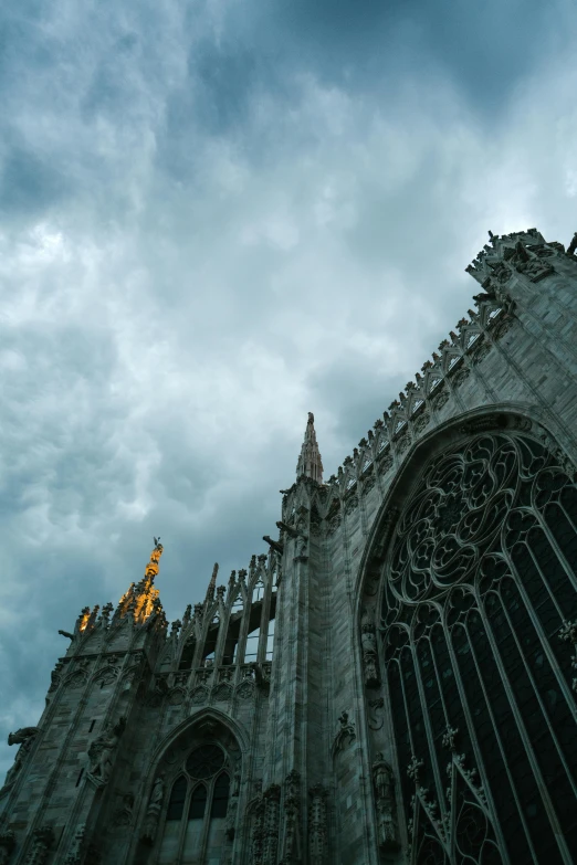 a very tall cathedral with a clock tower, an album cover, inspired by Michelangelo Buonarotti, pexels contest winner, grey cloudy skies, milan schere, tall golden heavenly gates, late summer evening