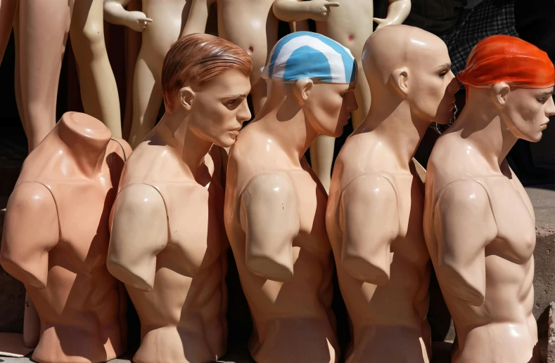 a group of mannequins sitting next to each other, by Lee Loughridge, plasticien, gay pride, latex flesh and facial muscles, thumbnail, greece