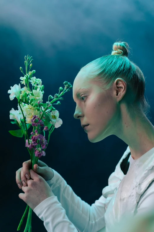 a woman holding a bunch of flowers in her hands, an album cover, inspired by Ignacy Witkiewicz, unsplash, hyperrealism, intense albino, greta thunberg, performance, looking to the right