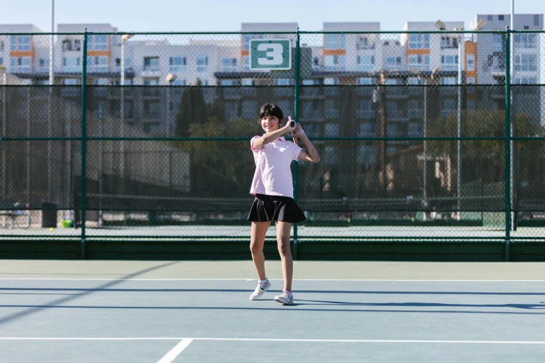 a woman standing on a tennis court holding a racquet, profile image, square, action shots, ryan jia
