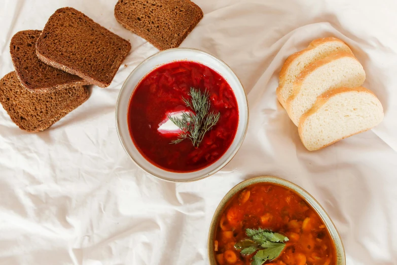 a bowl of soup next to a bowl of bread, by Emma Andijewska, pexels contest winner, khokhloma plate of borscht, thumbnail, full body image, 3 - piece