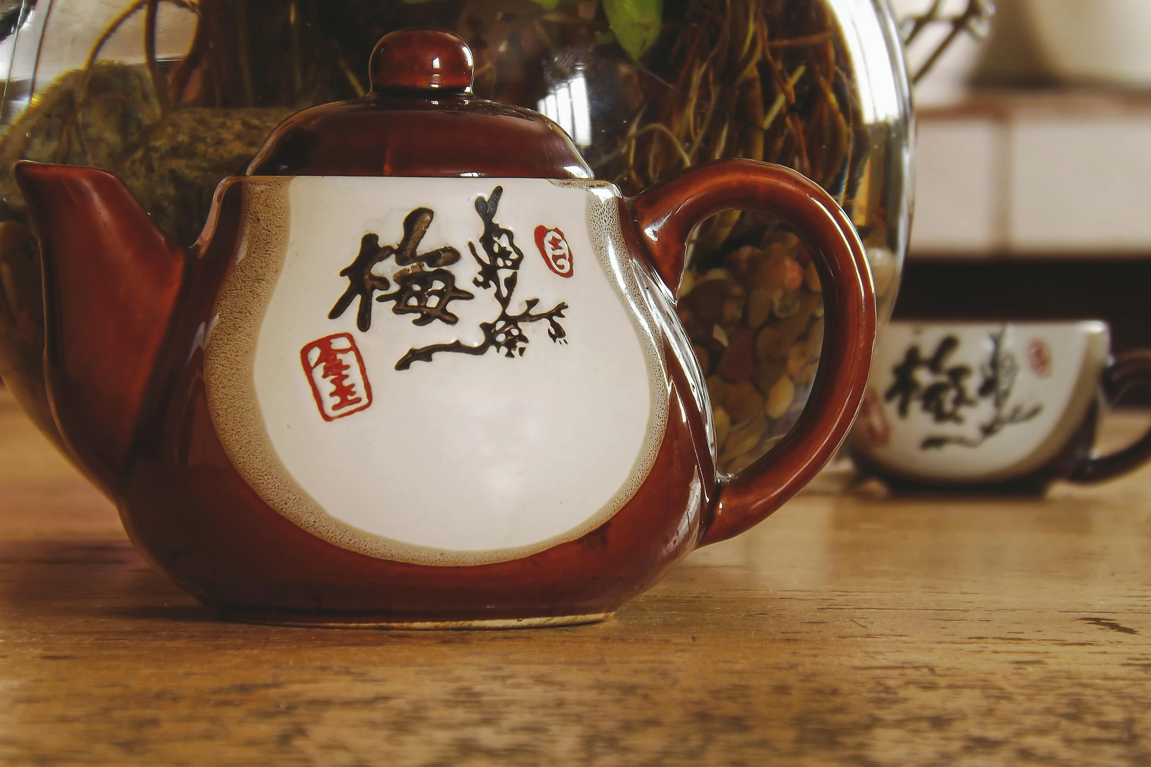 a tea pot sitting on top of a wooden table, an album cover, inspired by Gatōken Shunshi, unsplash, mingei, cai xukun, thumbnail, drink, hanafuda