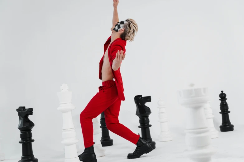 a woman in a red suit playing a game of chess, an album cover, inspired by Horace Vernet, trending on pexels, maximalism, laserpunk fullbodysuit, jumping for joy, xqc, full body photoshoot