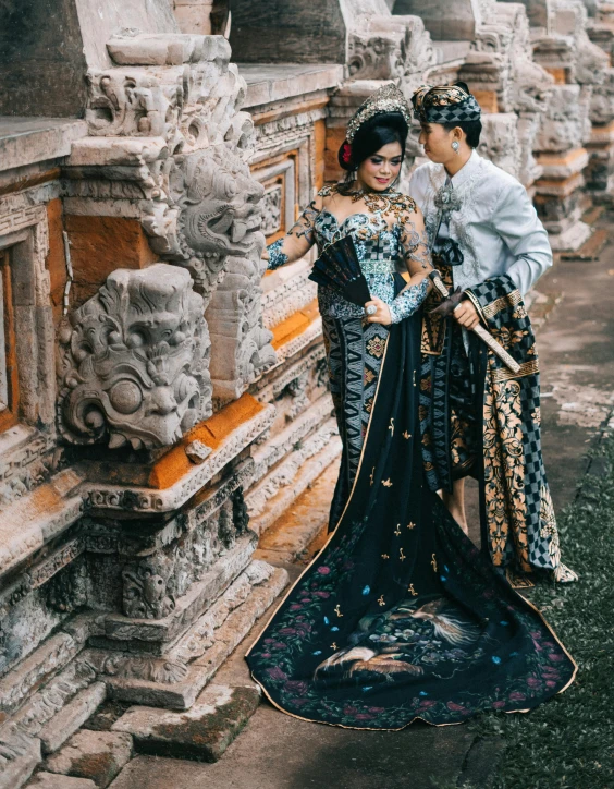 a man and a woman standing next to each other, a picture, pexels contest winner, sumatraism, ornate royal gown, square, gif, full pose