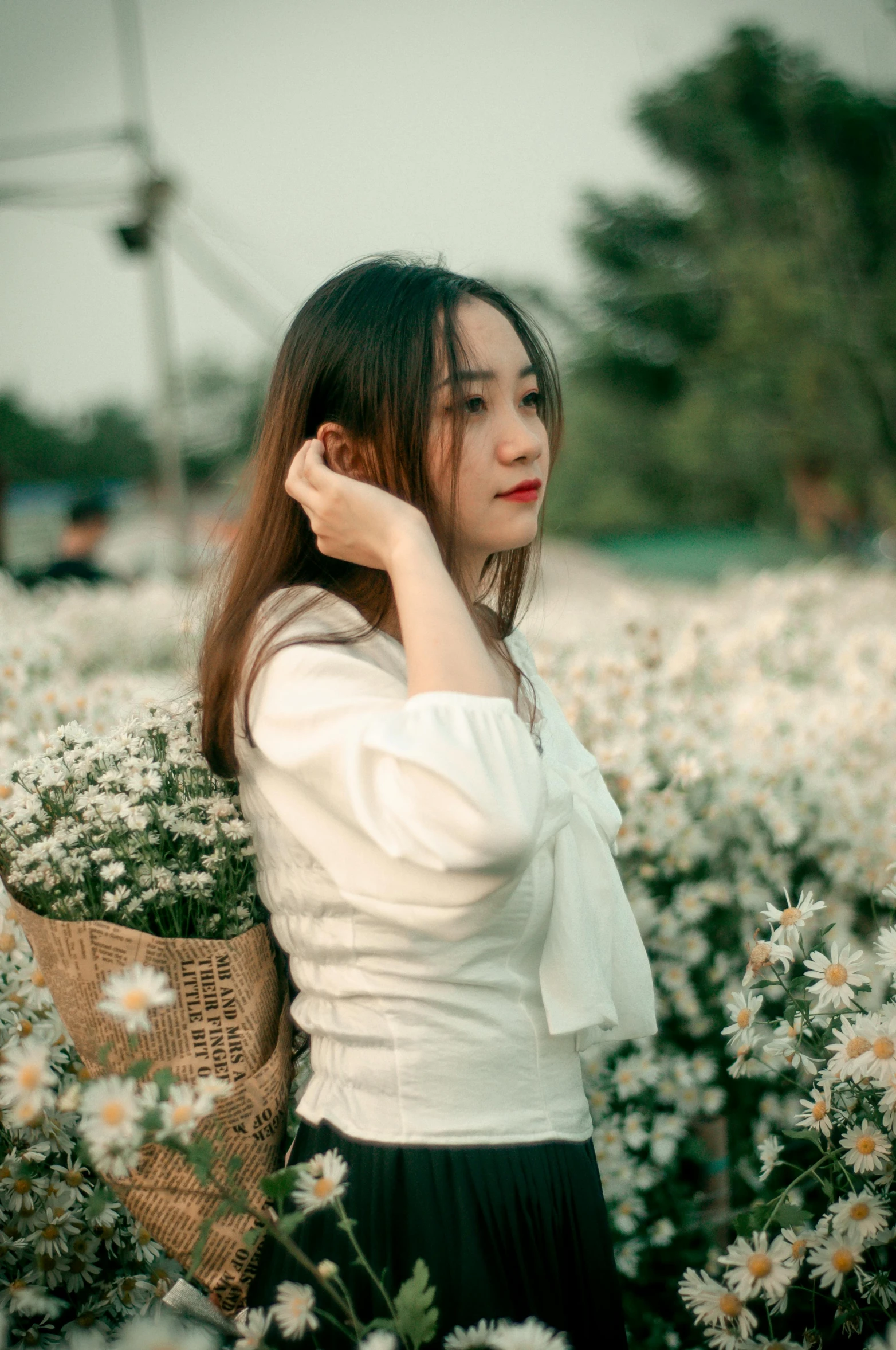 a woman standing in a field of flowers, by Tan Ting-pho, pexels contest winner, realism, white trendy clothes, young asian girl, thoughtful ), 🤬 🤮 💕 🎀