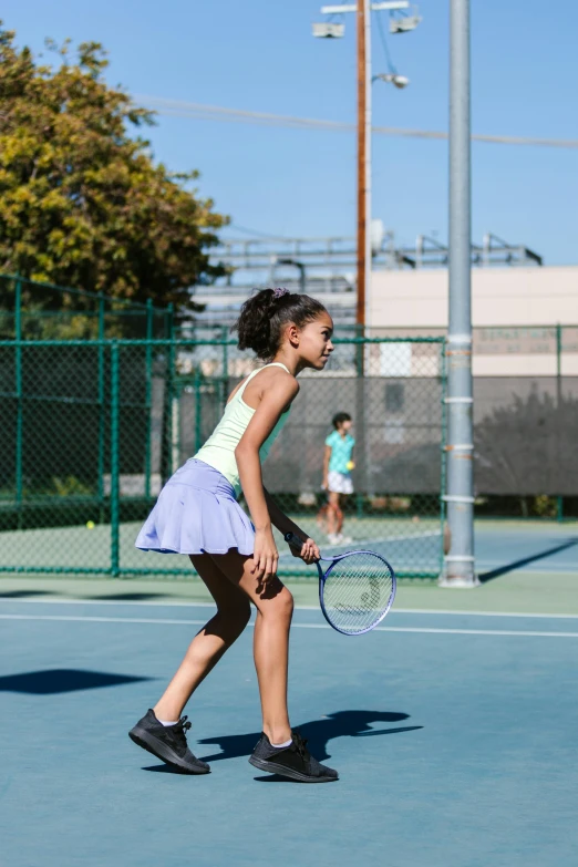 a young girl holding a tennis racquet on a tennis court, by Leo Michelson, unsplash, happening, panoramic view of girl, square, kids playing, pastel'