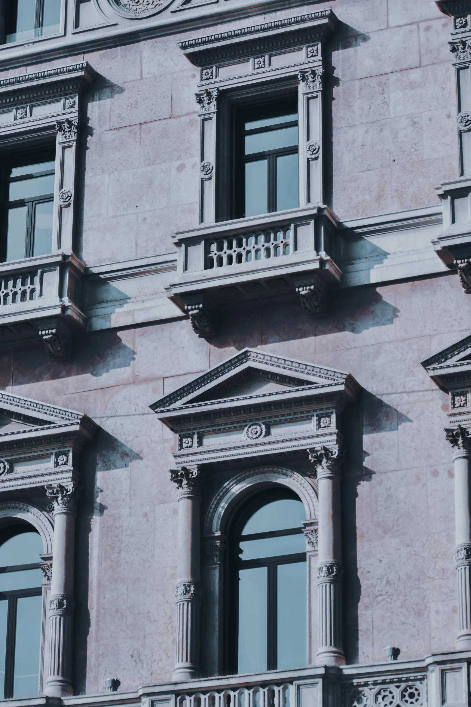 a clock that is on the side of a building, inspired by Ricardo Bofill, pexels contest winner, neoclassicism, bay window, pink marble building, baroque architecture, textured