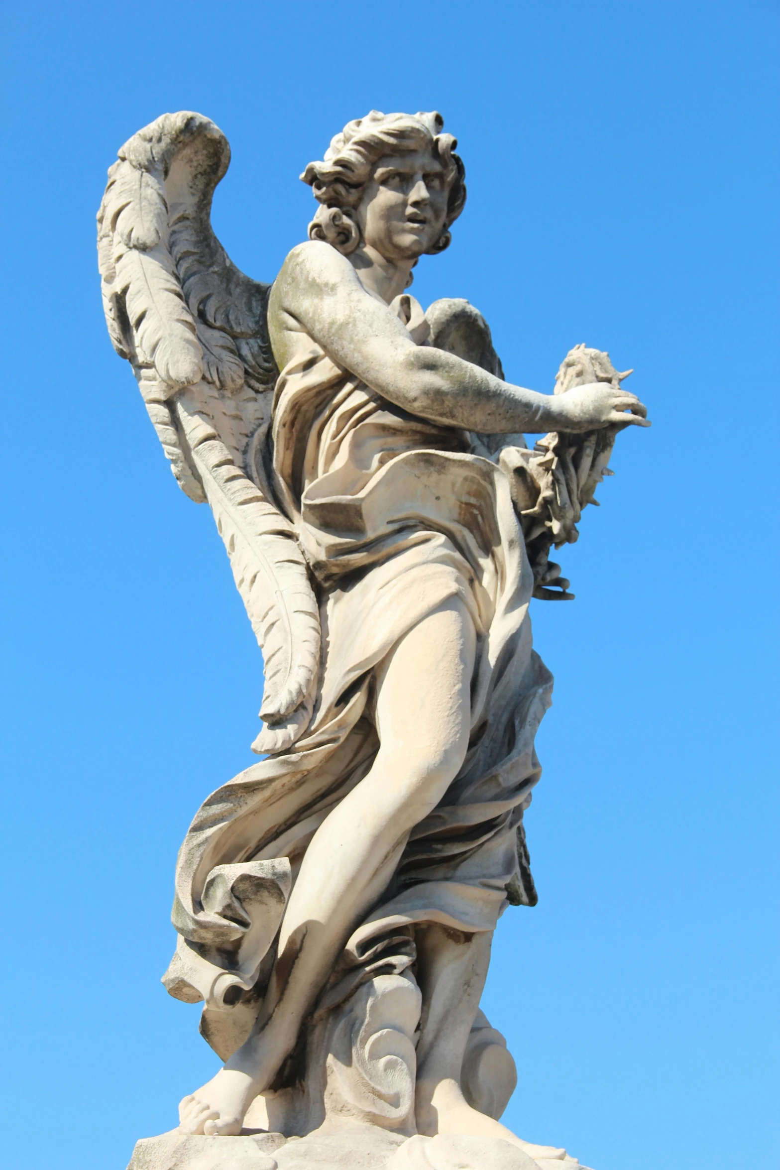 a statue of an angel on top of a building, by Gian Lorenzo Bernini, nice, taken in the late 2010s, adrian, james