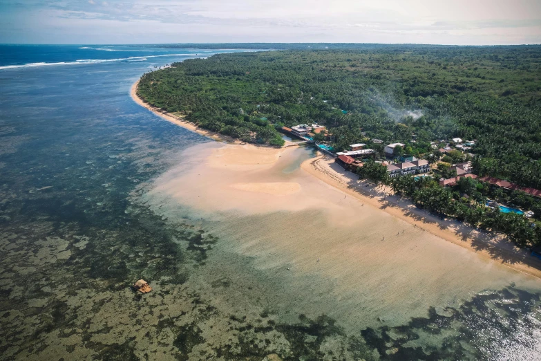 an aerial view of a beach in the middle of the ocean, hurufiyya, in a beachfront environment, sarenrae, ultra setting, low