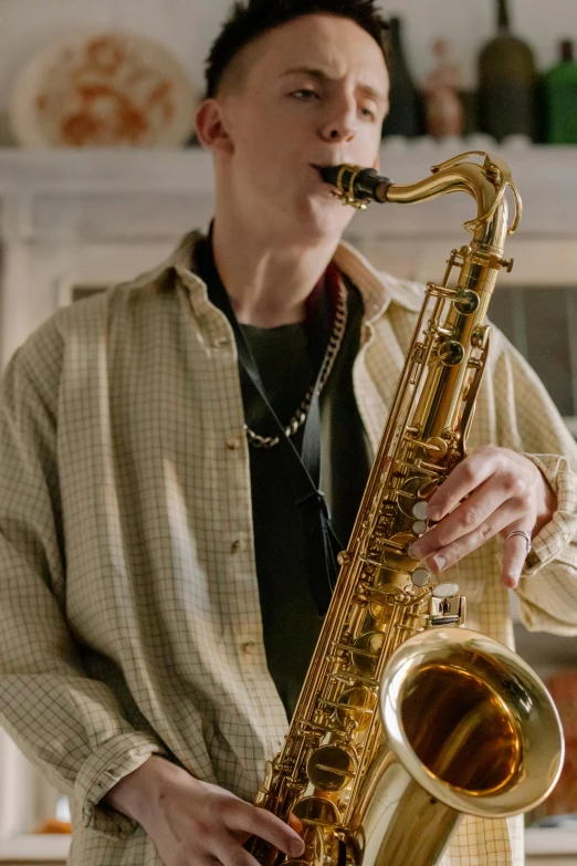 a man playing a saxophone in a kitchen, an album cover, trending on pexels, photorealism, declan mckenna, still frame from a movie, gold hour, medium close up shot
