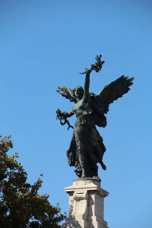 a statue of an angel on top of a building, inspired by Alexandre Falguière, black wings instead of arms, showing victory, the non-binary deity of spring, mucha |