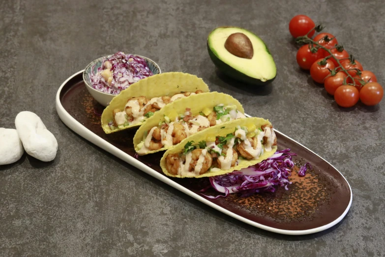 a couple of tacos sitting on top of a plate, detailed product image, slate, unbeatable quality, aokamei