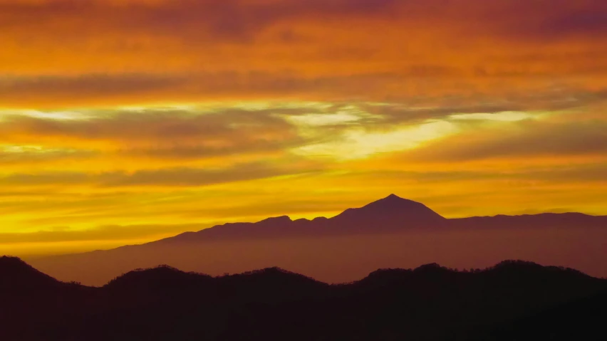 a sunset with a mountain in the background, inspired by Frederick Edwin Church, pexels contest winner, sumatraism, yellow, slide show, chile, murata range