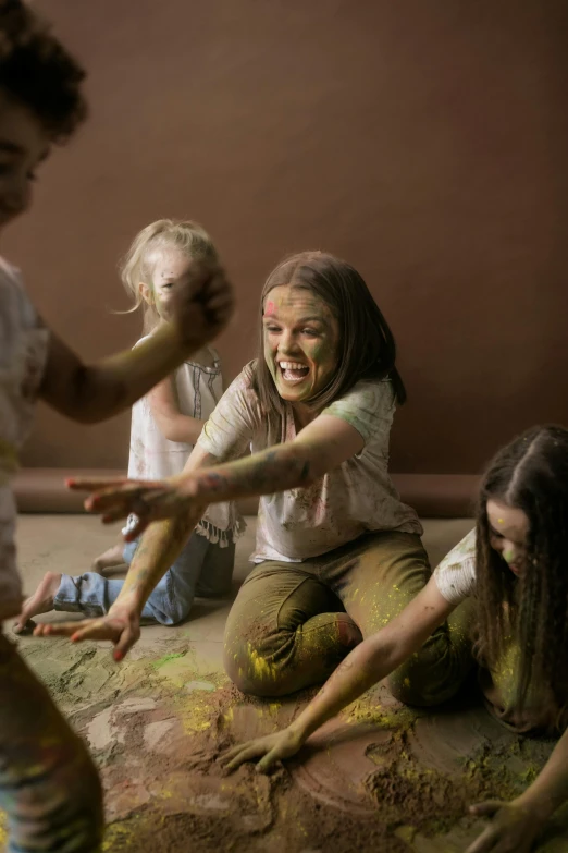 a group of people that are playing in the dirt, a cave painting, inspired by Helen Frankenthaler, shutterstock contest winner, action painting, portraits of a woman enraged, annoying sister vibes, still from film, brown