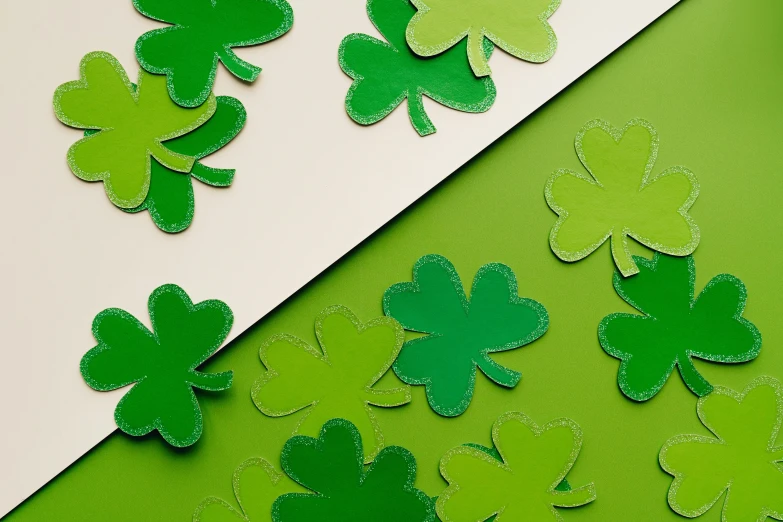 four leaf clovers on a green and white background, inspired by Ellsworth Kelly, trending on pexels, pair of keycards on table, large patches of plain colours, glowforge template, visible stitching