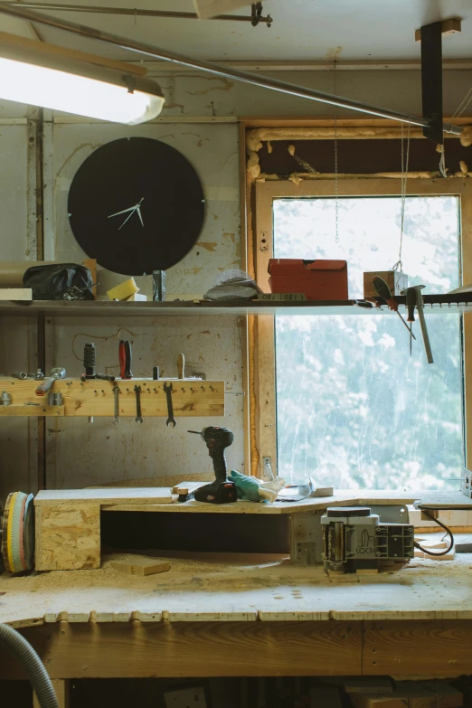 a workbench with a lot of tools on it, a portrait, inspired by Rube Goldberg, unsplash, big windows, a rustic album cover of a clock, ignant, panorama