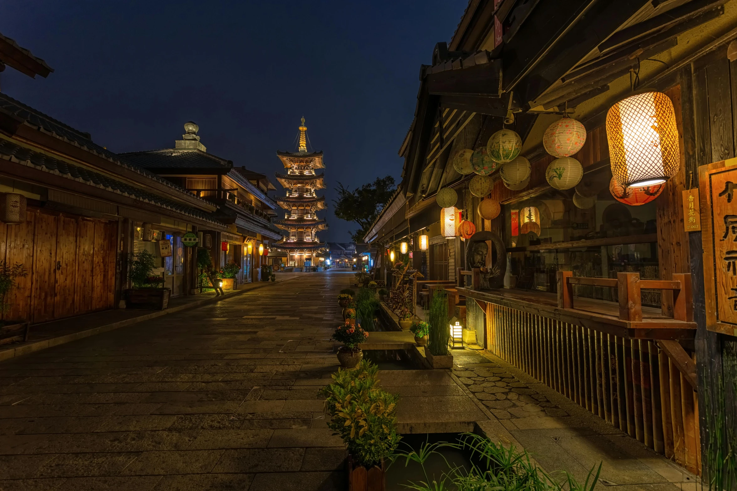 a street at night with lanterns and a pagoda in the background, wooden buildings, photograph, grey, daoshu