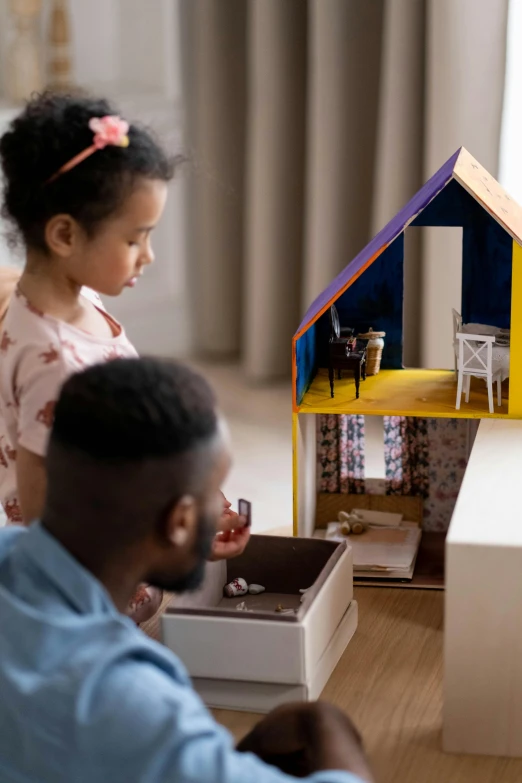 a man and a little girl playing with a doll house, pexels contest winner, conceptual art, upscaled to high resolution, ( ( dark skin ) ), gif, ikea