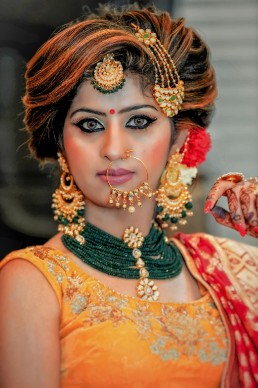 a beautiful indian woman posing for the camera, wearing elaborate green and gold, square, 4 k glamour photography, wedding