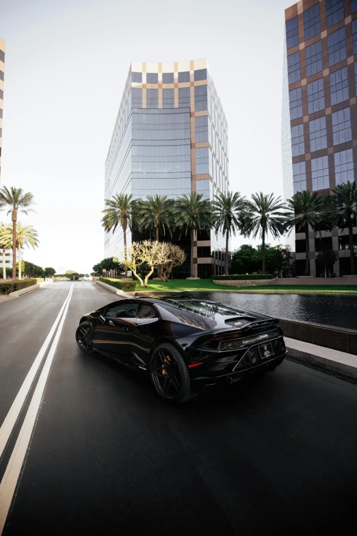 a black sports car driving down a city street, a picture, by Josh Bayer, renaissance, hyper detailed 8 k, southern california, high res 8k, wealthy