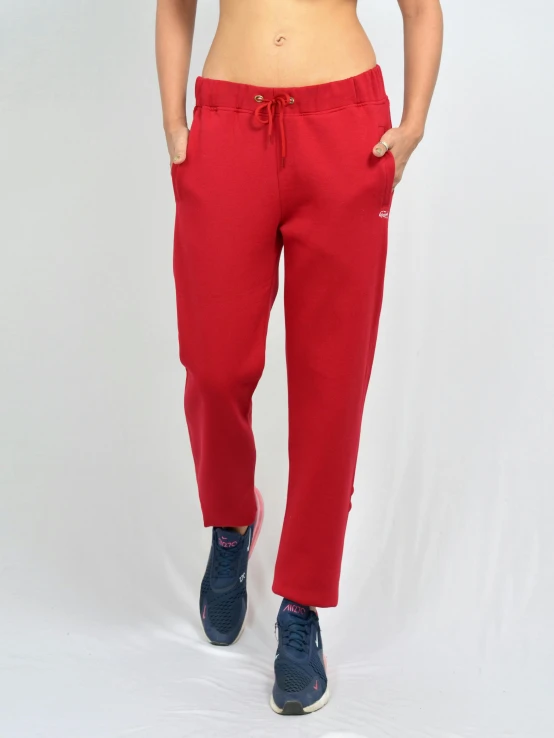a woman wearing red pants and a bra top, inspired by Jan Müller, antipodeans, wearing a hoodie and sweatpants, front on, 35 mm product photo”, plain