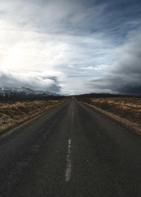 an empty road in the middle of nowhere, an album cover, by Hallsteinn Sigurðsson, trending on unsplash, realism, multiple stories, center of image, today\'s featured photograph 4k, ilustration