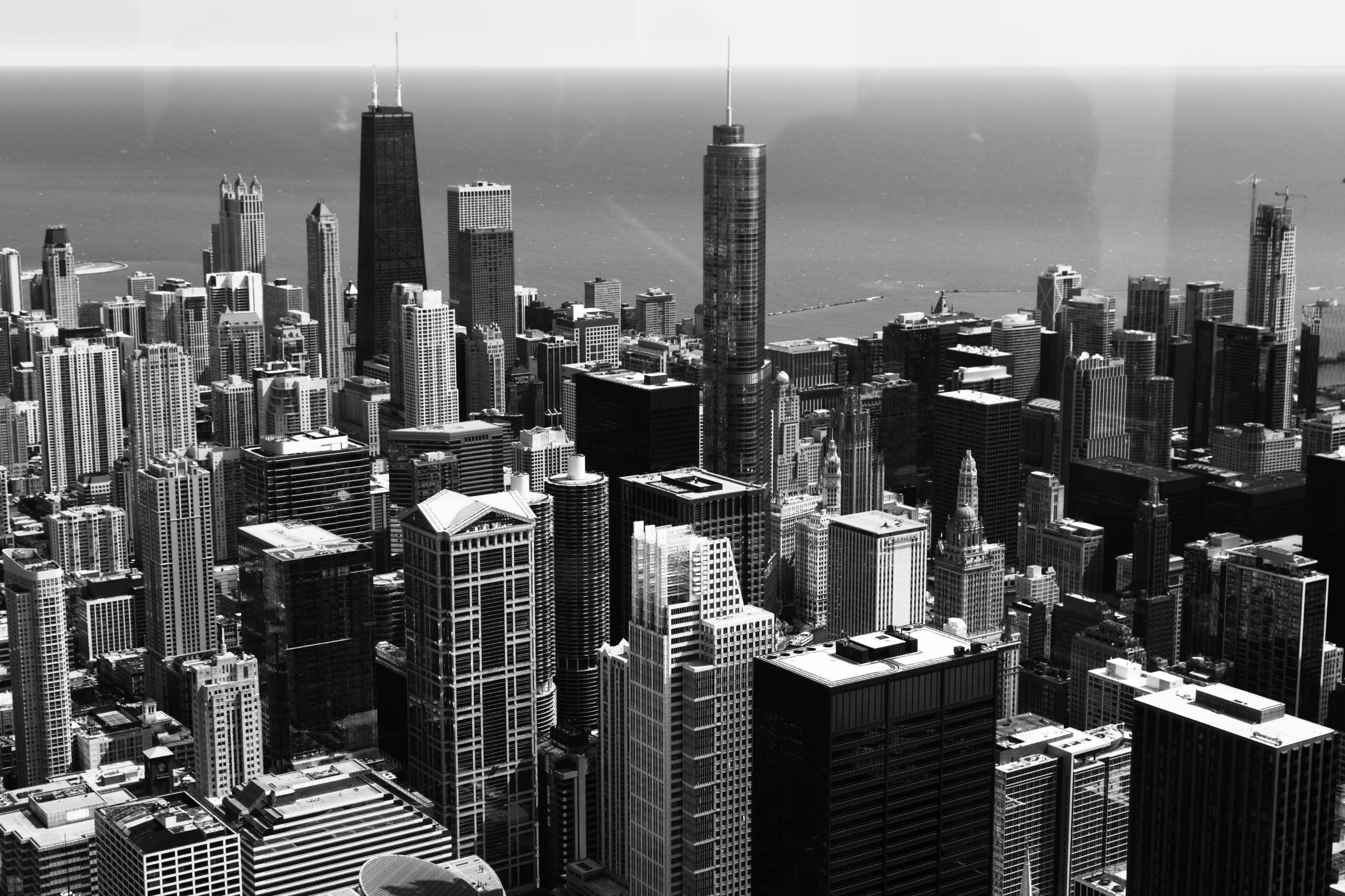 a black and white photo of the chicago skyline, birdseye view, detailed city background, 2 0 2 2 photo, high details photo