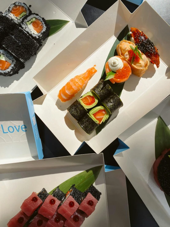 a table topped with lots of different types of sushi, true love, blue themed, 6 pack, thumbnail