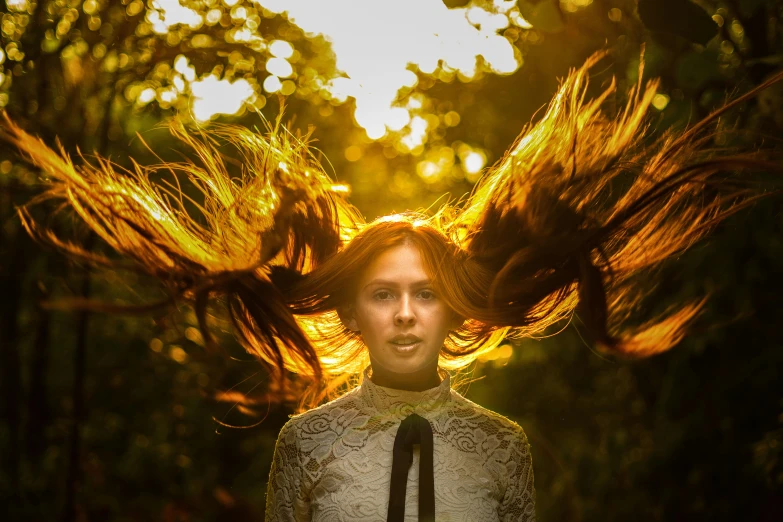 a woman with her hair blowing in the wind, a portrait, inspired by Brooke Shaden, pexels contest winner, renaissance, long ginger hair, golden hour 8k, kirsty mitchell, symmetric portrait