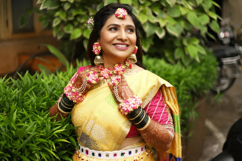 a woman in a yellow sari posing for a picture, instagram, samikshavad, portrait image, decorated with flowers, thumbnail, jewellery