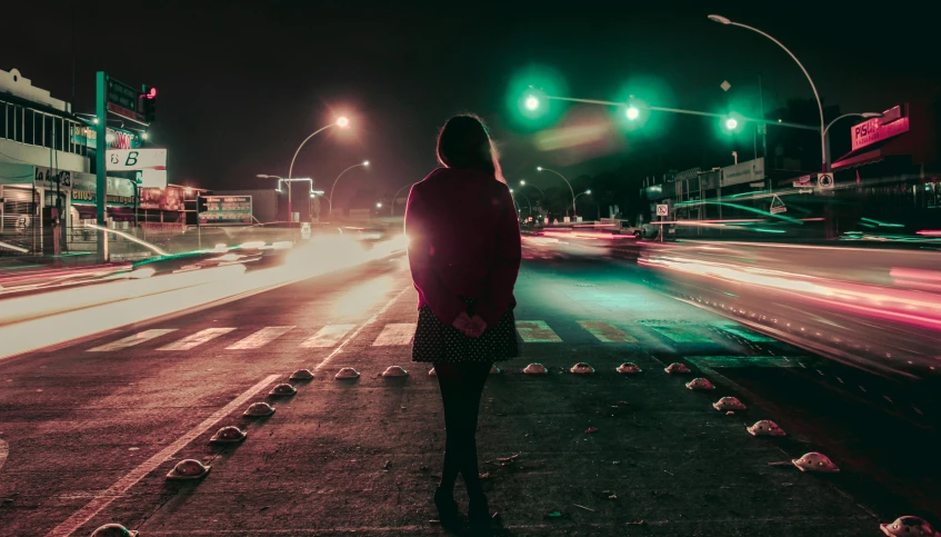 a woman standing on the side of a road at night, pexels contest winner, realism, red and green tones, lonely!! stop light glowing, teenage girl, instagram post