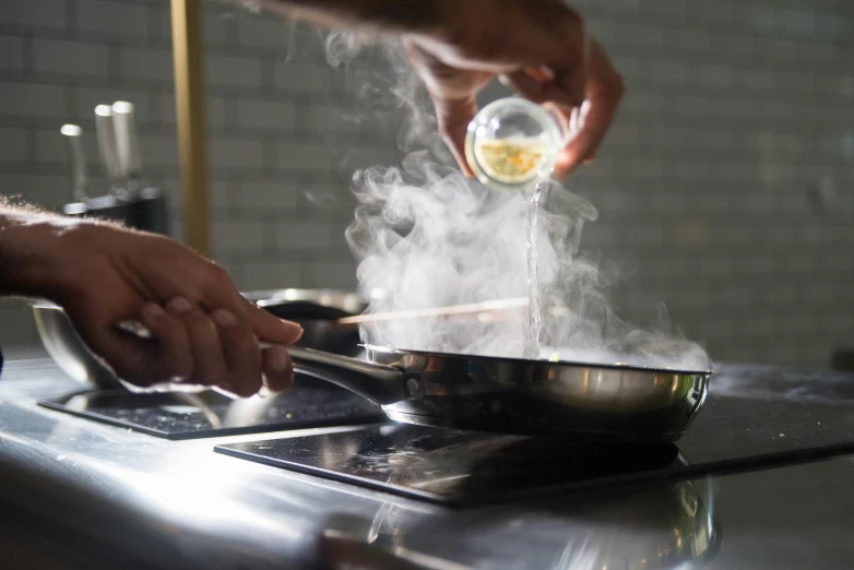 a close up of a person cooking food on a stove, liquid gold, fan favorite, chefs table, dwell